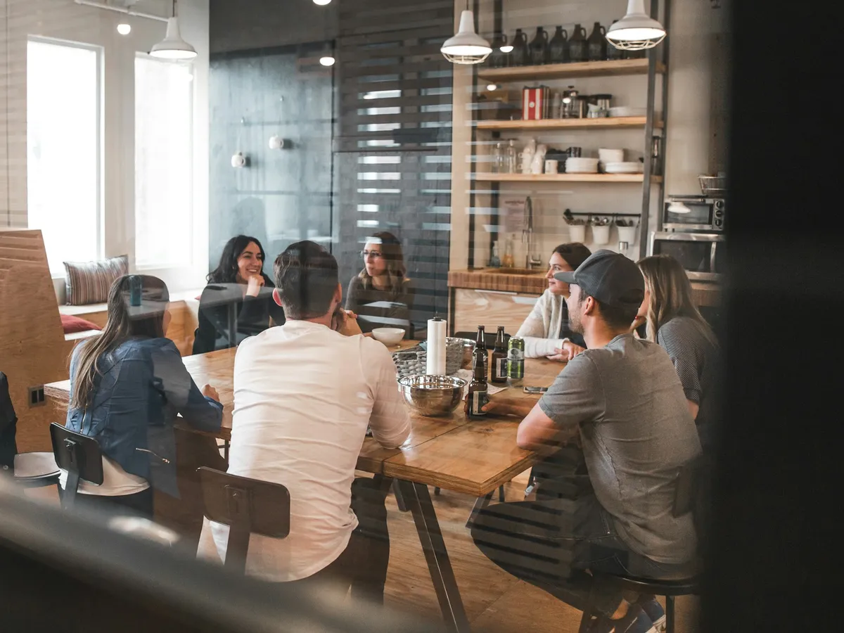 A team working together around a long table